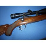 Ruger 77/22 .22LR bolt action rifle with detachable box magazine, fitted with sound moderator and