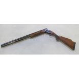 Miroku O/U single trigger trap shotgun. Floral engraving to lock. Some repair work to forend. Length