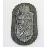 WWII German Narvik Shield with cloth backing. backing paper and four prongs intact