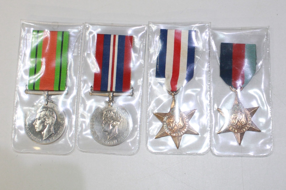 A selection of four medals. To include a France and Germany Medal, a 1939-1945 Star, a George VI