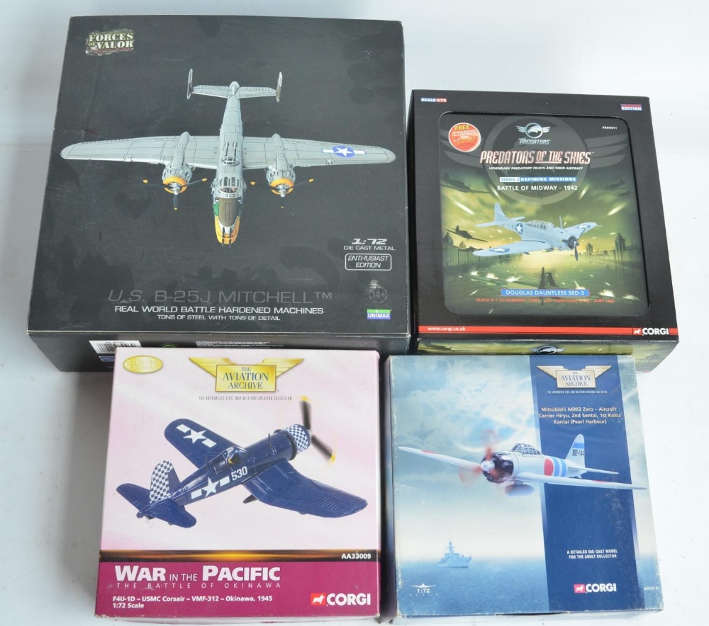 Four 1/72 scale diecast WWII US aircraft models to include Forces Of Valor B-25J Mitchell (fair/good