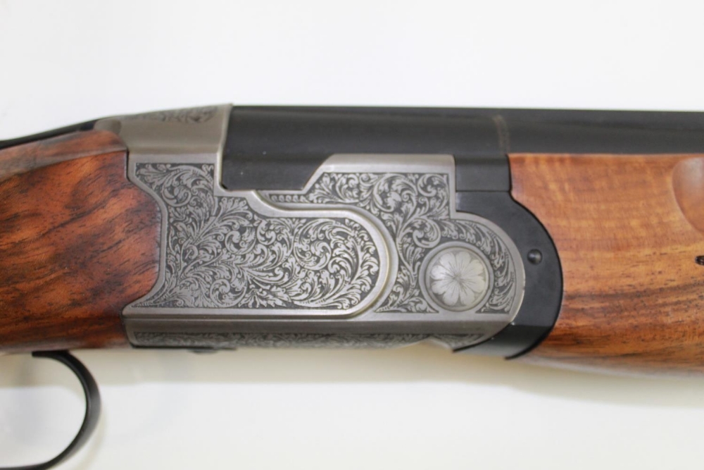 Ataarms over/under double barrel multi choke shotgun ejector with single trigger and vented barrels. - Image 2 of 5