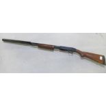 Mossberg pump-action 410 shotgun with fitted moderator. Serial number V0719512. Barrel and moderator