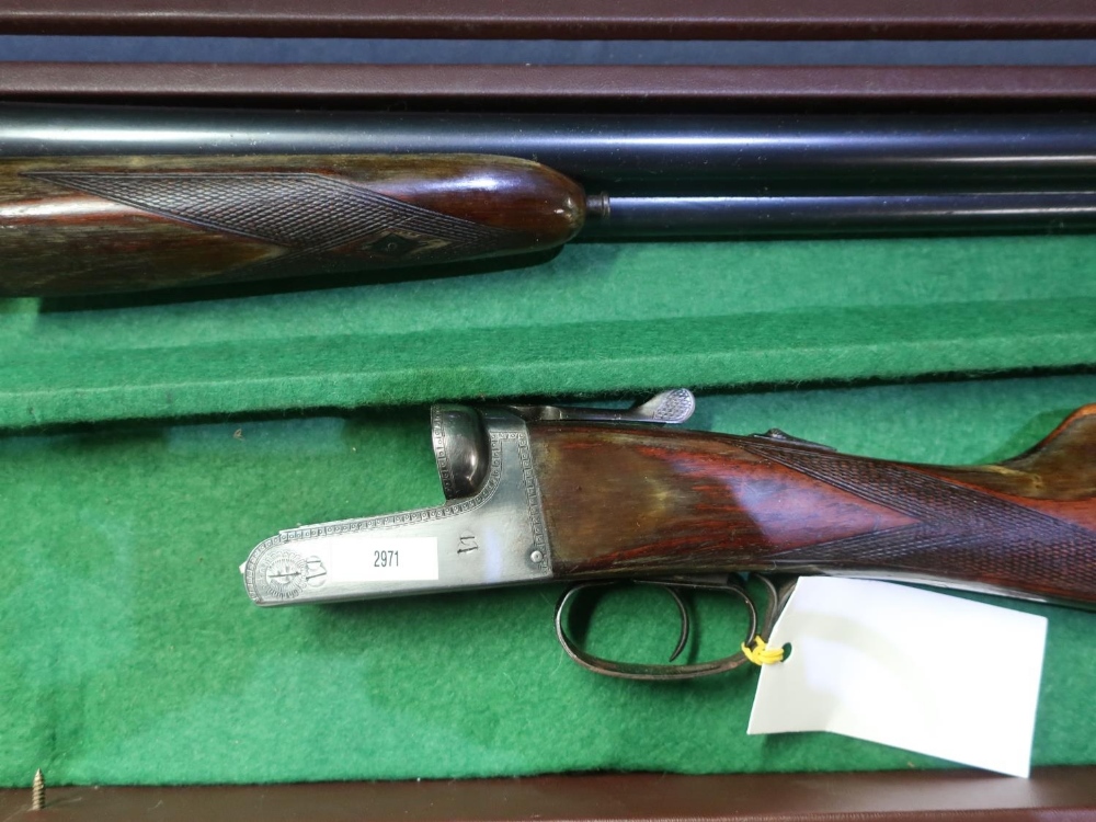 Cased Sable 12 bore side by side shotgun with 25 3/4 barrels, 14.5 inch straight through stock