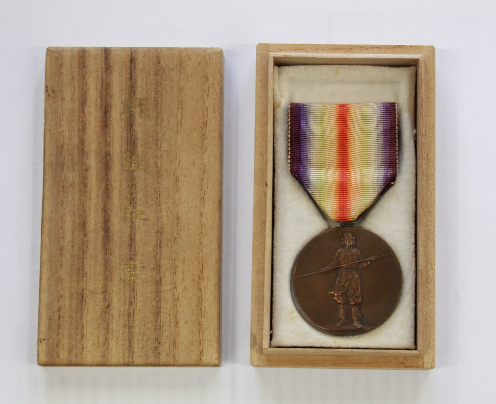 Japanese Allied Victory Medal, complete with ribbon and in original balsa wood box.