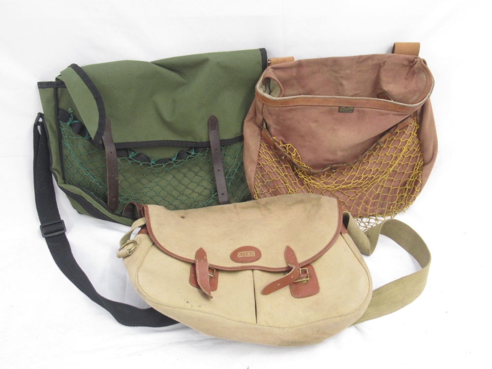 Collection of three canvas fishing bags. To include a vintage Aiken bag with three compartments