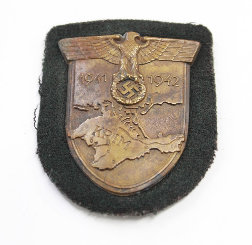 Wehrmacht Krim Campaign Shield(Crimea) Complete with prongs and original cloth backing.