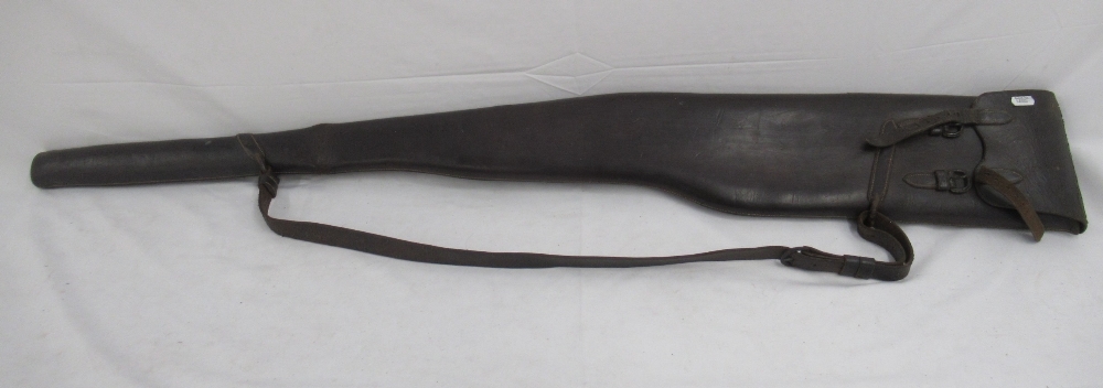 Unbranded leather gun slip with cleaning rod compartment, complete with cleaning rod. Scuffs and