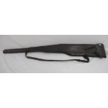 Unbranded leather gun slip with cleaning rod compartment, complete with cleaning rod. Scuffs and