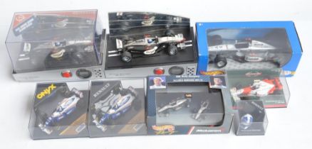 Collection of plastic and diecast David Coulthard themed Formula 1 racing car models to include 2