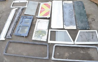 Collection of Land Rover Defender and earlier series aluminium panels, windscreen surrounds,