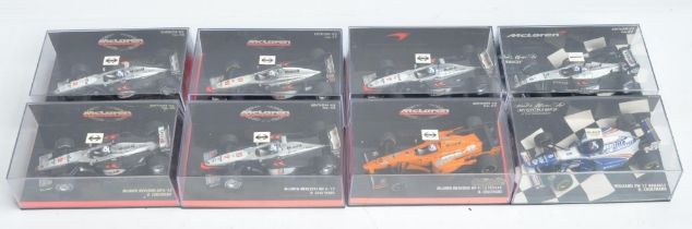 Eight boxed 1/43 scale diecast David Coulthard themed Formula 1 racing car models from Paul's