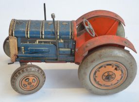 Vintage tinplate lithographed clockwork tractor model, marked Made In Great Britain but no makers