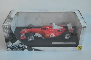 Hot Wheels Racing series 1/18 scale Ferrari F2004 Michael Schumacher with seated driver figure (