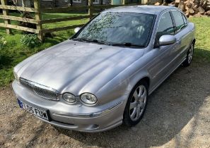 Jaguar X type 4wd saloon in silver, full black leather interior and walnut dashboard. 2.5 ltr