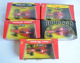 Five 1/24 scale Ferrari Formula 1 racing cars to include F300 1998, F310B etc. All models in mint