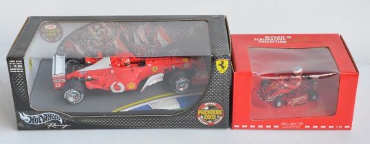 Two 1/18 scale diecast car models to include Hot Wheels 2003 Premier limited edition Michael