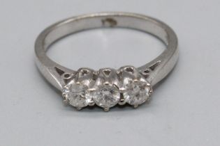 18ct white gold three stone diamond ring, stamped 750, size L, 3.4g (A/F - chipped stone)