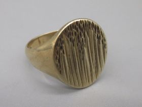 9ct yellow gold ring with oval textured face, stamped 375, Z1/2, 9.41g