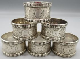 Set of six Victorian silver napkin rings, numbered 1 - 6 with engine turned pattern by George Unit