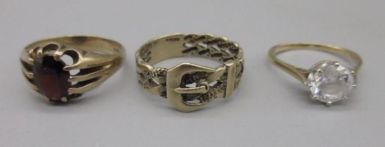 9ct yellow gold belt buckle ring, size T, a 9ct gents ring set with red stone, size S1/2, and a