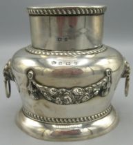 George V1 silver tea caddy and cover, ovoid body with floral swag, gadrooned borders and lion mask