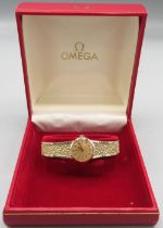 Ladies Omega 9ct gold wristwatch, signed gold tone dial, applied baton indices, integrated mesh