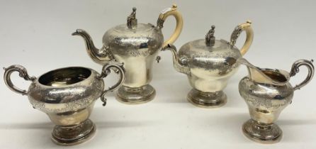 William IV silver four piece pear shaped coffee and tea service, chased Chinoiserie decoration,