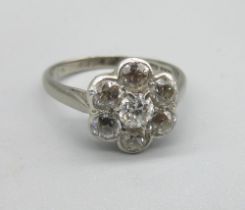 18ct white gold diamond cluster ring, the seven old cut diamonds set in flower shaped cluster, in