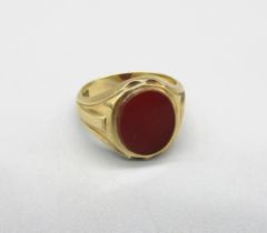9ct yellow gold signet ring, the oval face set with polished carnelian, M1/2, 5.86g