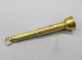 18ct yellow gold cigar piercer with engine turned detail, with engraved initials C.L.P.M to rim, 9.