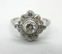 Platinum diamond cluster ring, the central round cut diamond surrounded by a halo of smaller