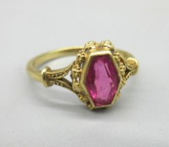 18ct yellow gold ring set with hexagonal cut ruby in rub over mount with ornate border, on plain