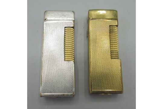 Dunhill Patented gold plated butane cigarette lighter, engine turned decoration and similar silver