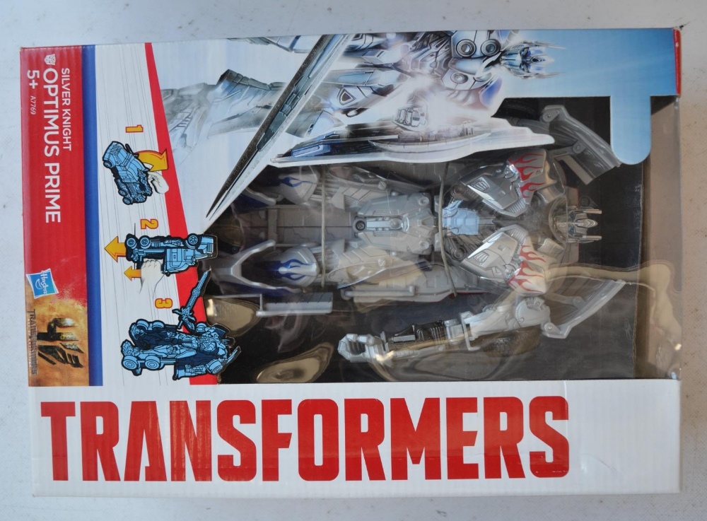 Four Transformer models from Hasbro to include Silver Knight Optimus Prime (approx 8.5", box factory - Image 2 of 9