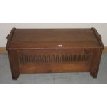 20th century oak coffer, hinged top and Gothic arch carved front on shaped bracket feet, W104cm