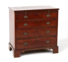 Property of a lady - a small George III mahogany chest of four long graduated drawers with