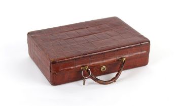 Property of a lady - an early 20th century crocodile skin attache case, with Bramah lock & key,