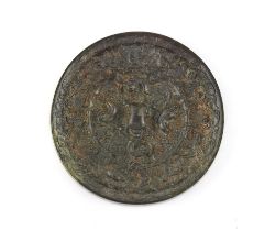 Property of a lady - a Chinese bronze mirror, in the Tang style, 4.4ins. (11.2cms.) diameter.