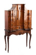 Property of a lady - an 18th century Continental walnut cabinet with an arrangement of ten drawers