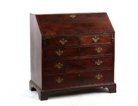 Property of a gentleman - a George III mahogany fall-front bureau with fitted interior above four