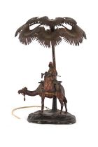 A large early 20th century Austrian cold painted bronze lamp modelled as a Arab Warrior on a Camel