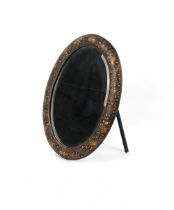 Property of a gentleman - an Indian Kashmiri floral decorated lacquer oval framed easel mirror, with