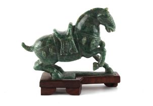 Property of a lady - a Chinese Tang style carved nephrite jade model of a horse, the base re-
