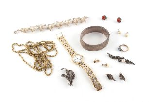 Property of a lady - a bag containing assorted costume jewellery including a silver hinged bangle