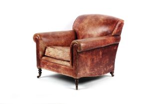 Property of a lady - a George Smith leather upholstered armchair, with turned front legs & castors.