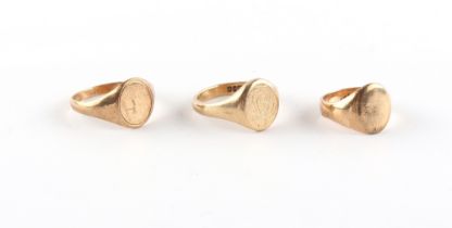 Property of a deceased estate - three 9ct gold signet rings, sizes M, V and W, approximately 17.2