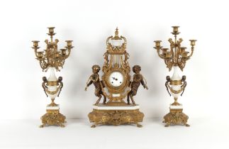 Property of a gentleman - a large ornate gilt metal three piece clock garniture, the clock of lyre