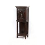 Property of a lady - a late 19th century North European carved oak cabinet, with linenfold side