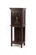 Property of a lady - a late 19th century North European carved oak cabinet, with linenfold side